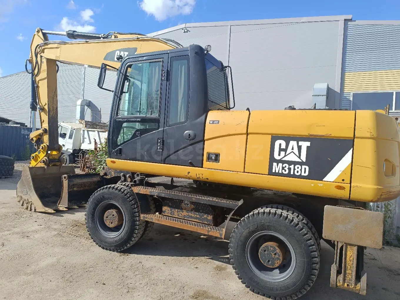 Услуги колёсного экскаватора - фото 4